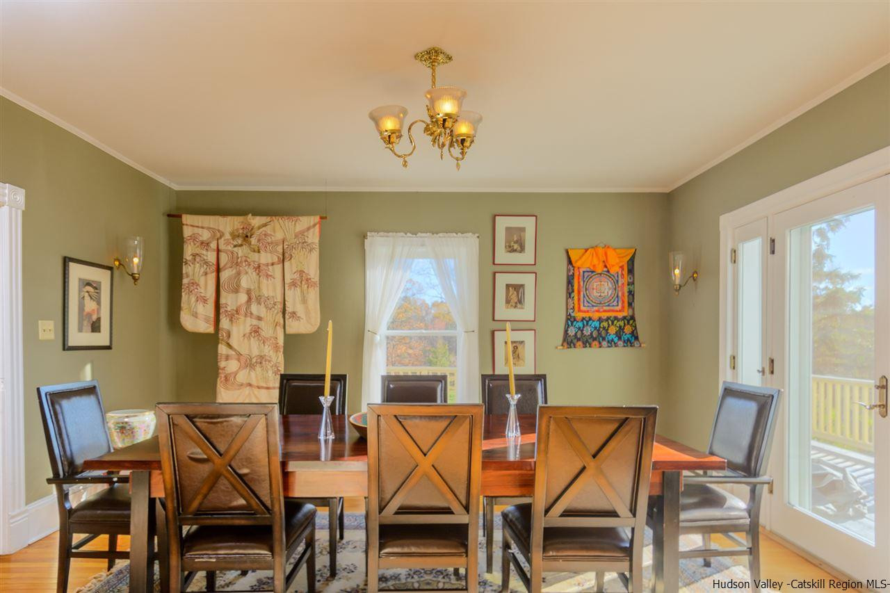 11 Sherman Road Woodstock, NY 12498 - Photo 12 of 19 a view of a dining room with furniture and a chandelier