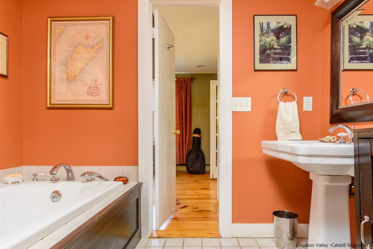 11 Sherman Road Woodstock, NY 12498 - Photo 14 of 19 a en suite bathroom with a sink and a large mirror