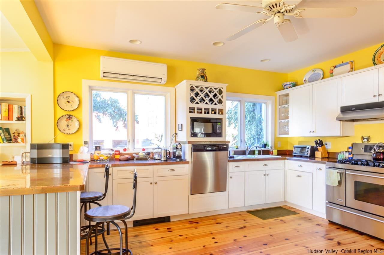 11 Sherman Road Woodstock, NY 12498 - Photo 4 of 19 a kitchen with a sink stove and refrigerator