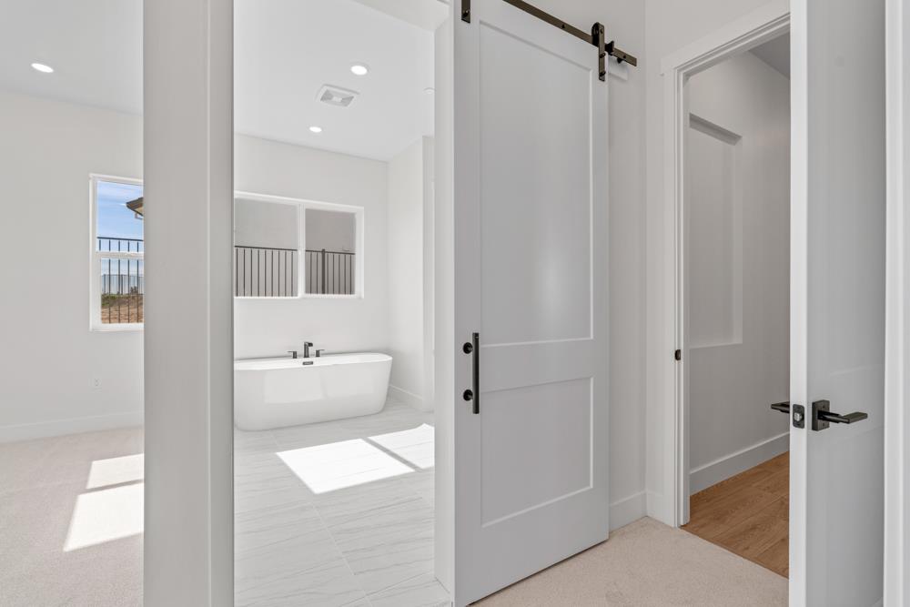 14854 Grace Warren Way Rancho Murieta, CA 95683 - Photo 24 of 27 a bathroom with a tub and shower