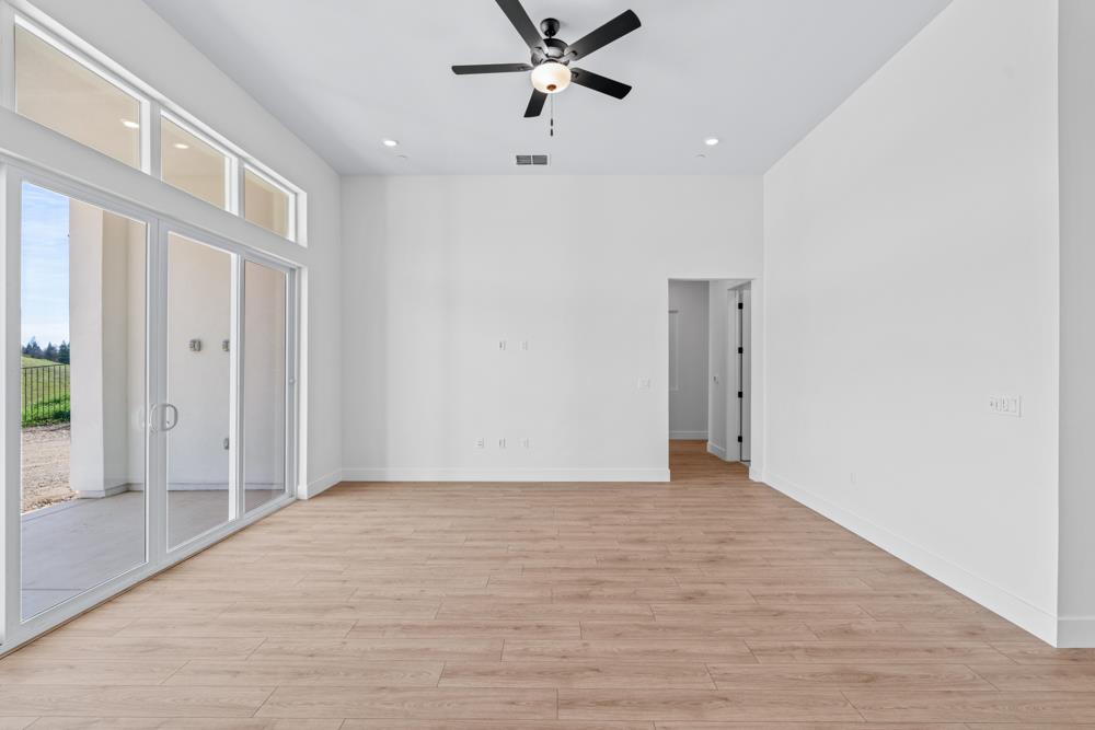 14854 Grace Warren Way Rancho Murieta, CA 95683 - Photo 4 of 27 a view of an empty room with a ceiling fan