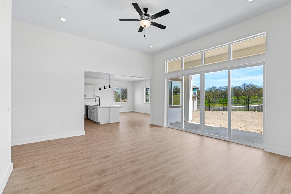 14854 Grace Warren Way Rancho Murieta, CA 95683 - Photo 6 of 27 a view of an empty room with a window and wooden floor