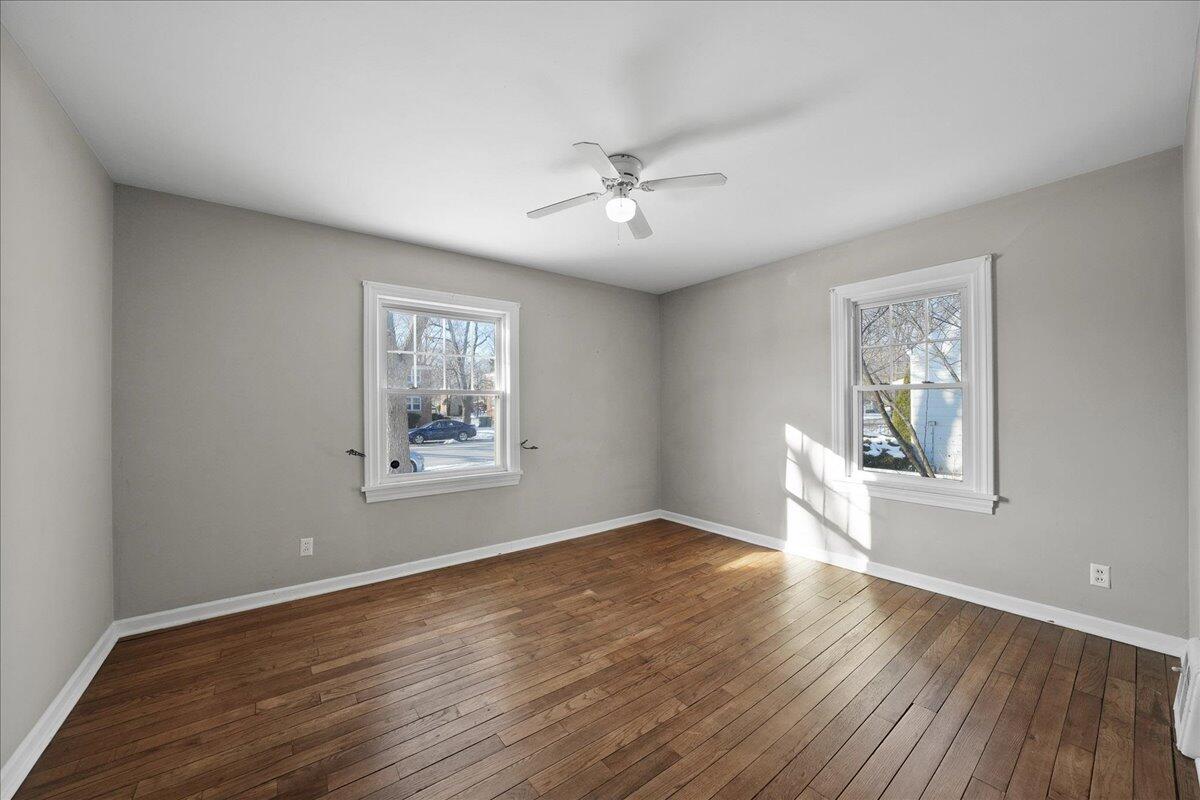 1102 Lafayette Street Valparaiso, IN 46383 - Photo 12 of 25 a view of an empty room with wooden floor and a window