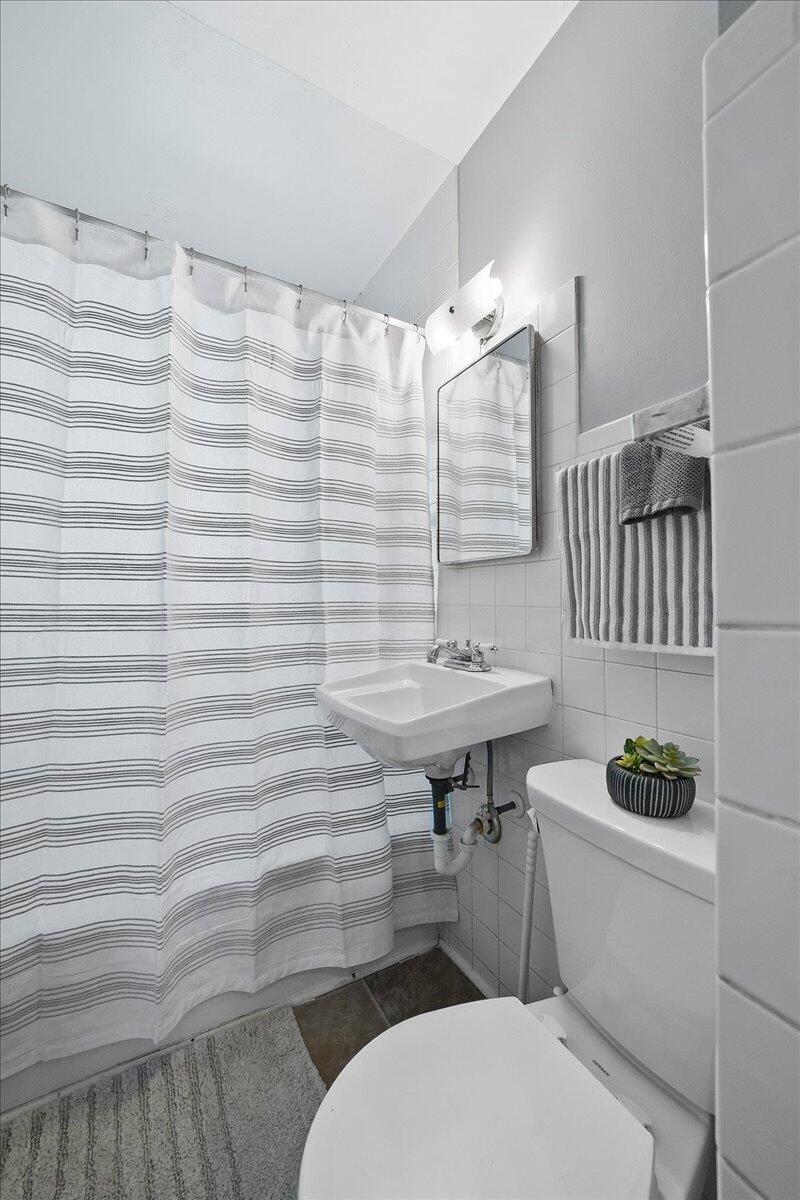1102 Lafayette Street Valparaiso, IN 46383 - Photo 13 of 25 a bathroom with a sink toilet and shower