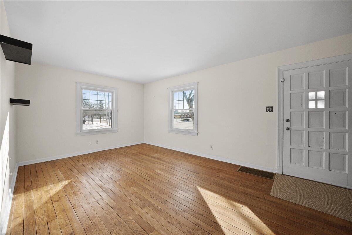 1102 Lafayette Street Valparaiso, IN 46383 - Photo 17 of 25 a view of an empty room with wooden floor and a window