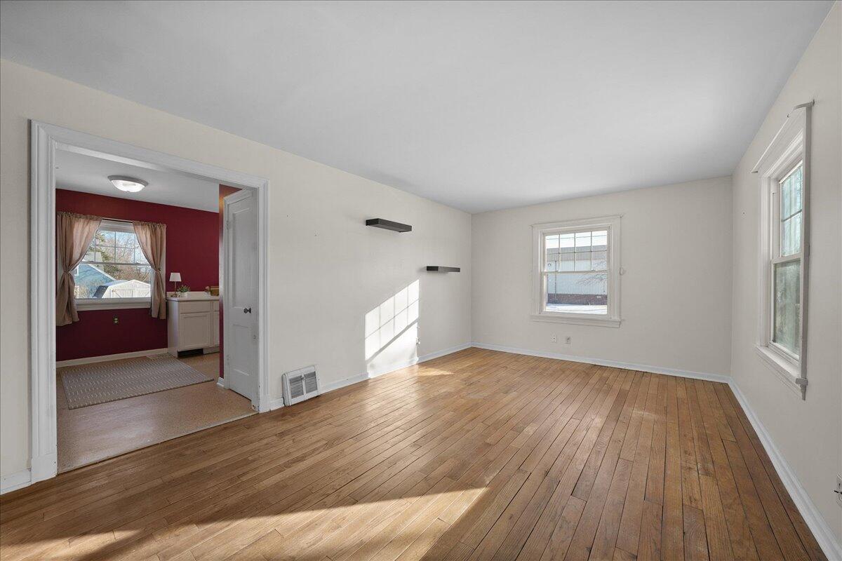 1102 Lafayette Street Valparaiso, IN 46383 - Photo 5 of 25 wooden floor in an empty room with a window