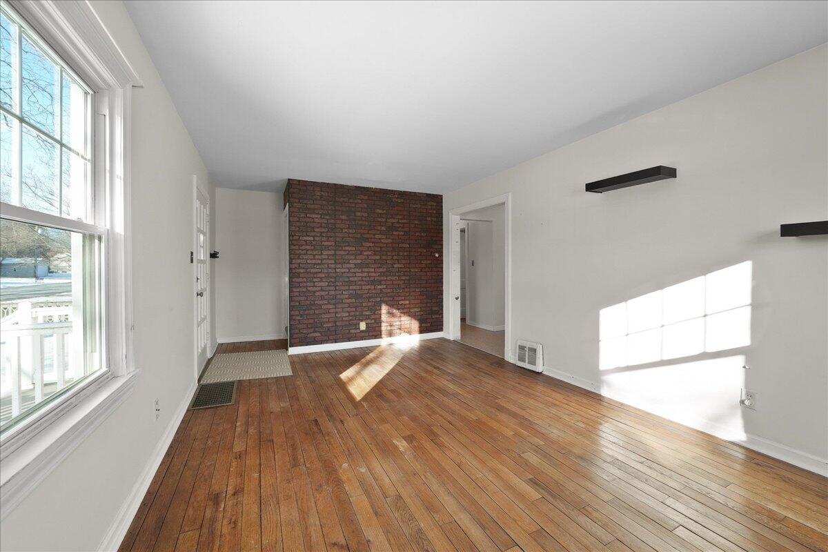 1102 Lafayette Street Valparaiso, IN 46383 - Photo 6 of 25 a view of a livingroom with wooden floor