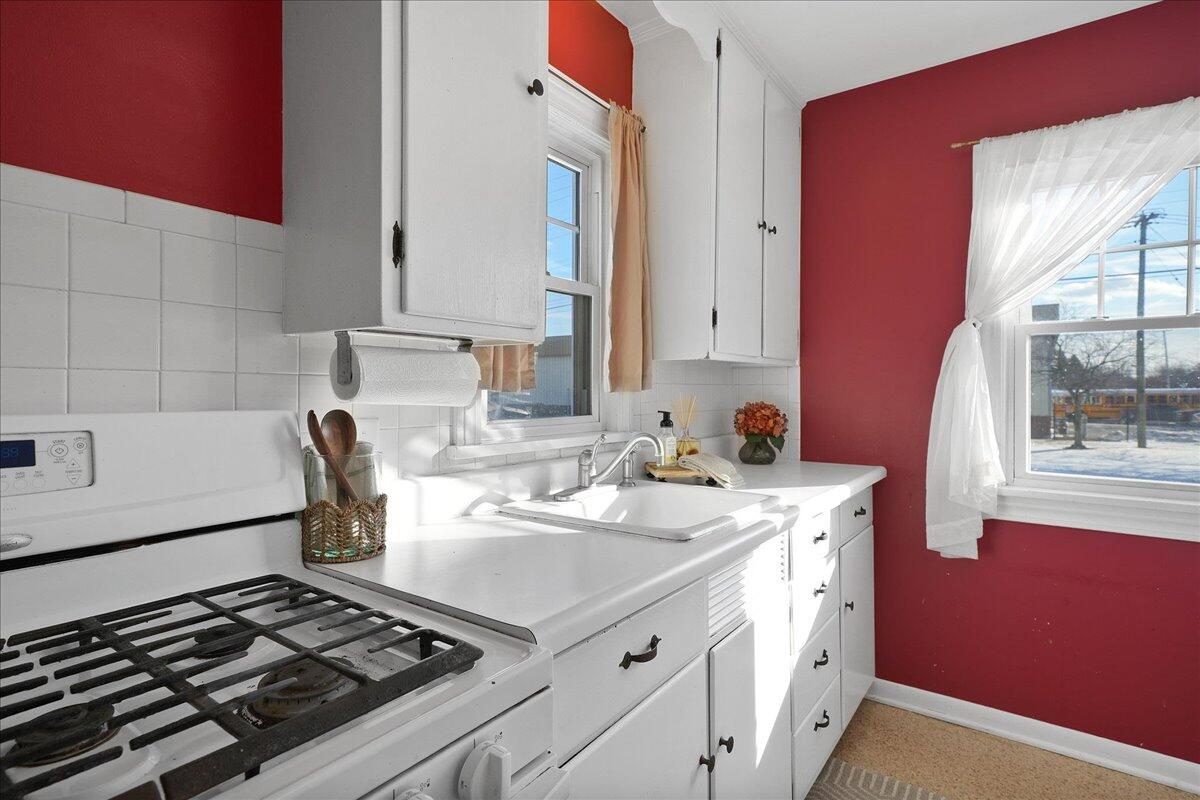 1102 Lafayette Street Valparaiso, IN 46383 - Photo 10 of 25 a kitchen with a stove and a sink