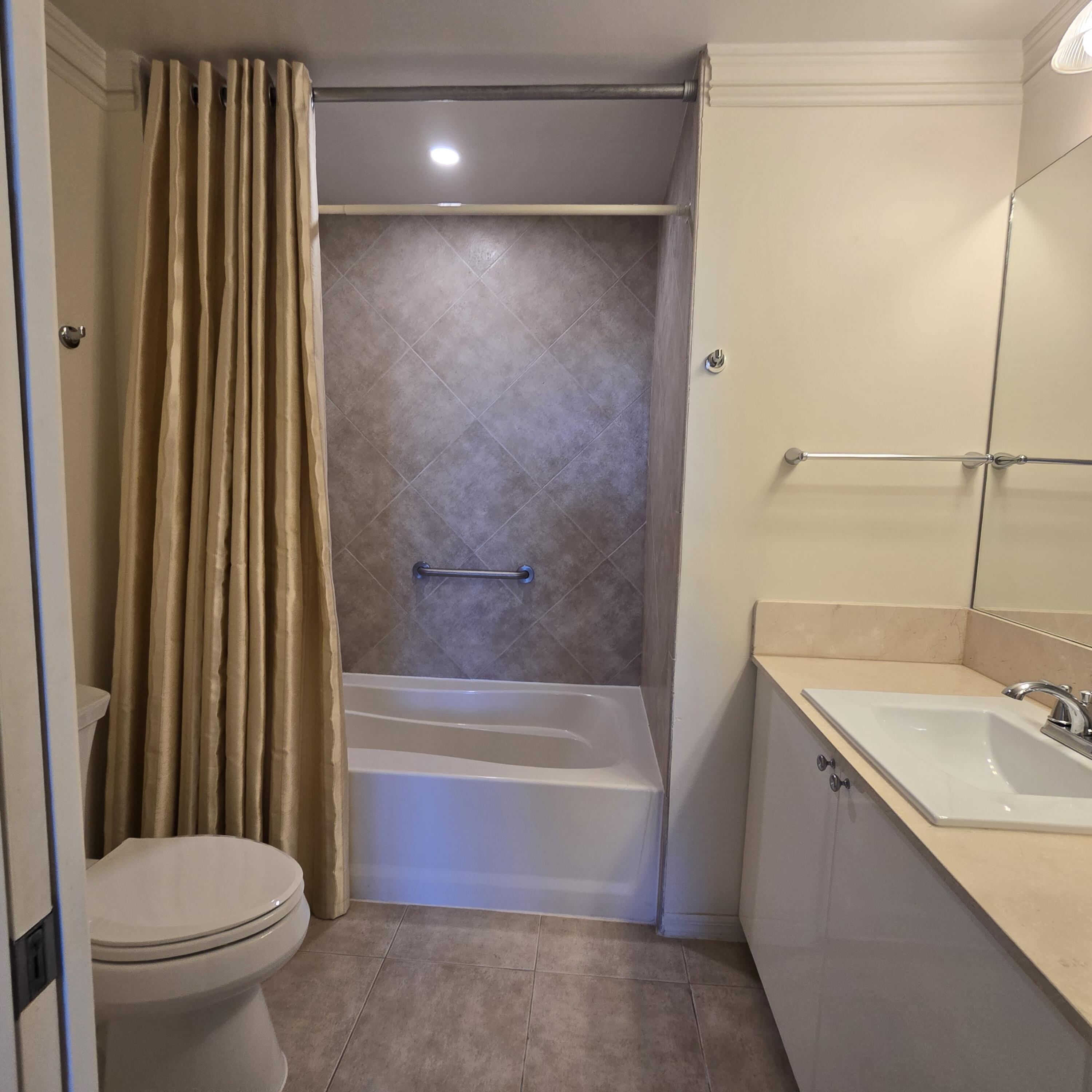 233 South Federal Highway, Unit 721 Boca Raton, FL 33432 - Photo 12 of 50 a bathroom with a sink toilet and shower