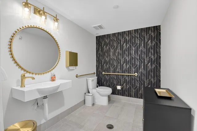 a living room with furniture a table and a chandelier