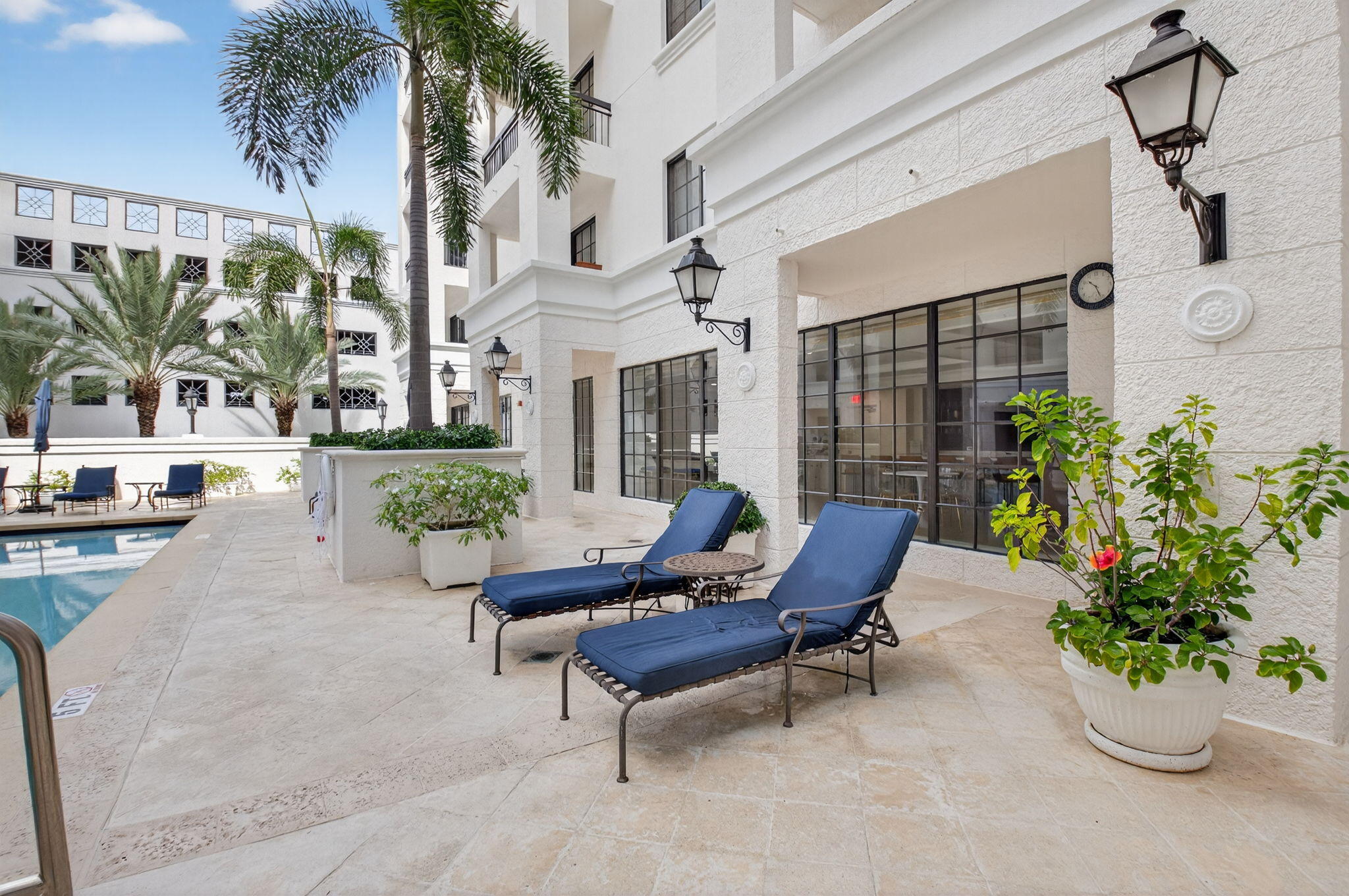 233 South Federal Highway, Unit 721 Boca Raton, FL 33432 - Photo 28 of 50 a building outdoor space with patio furniture and potted plants