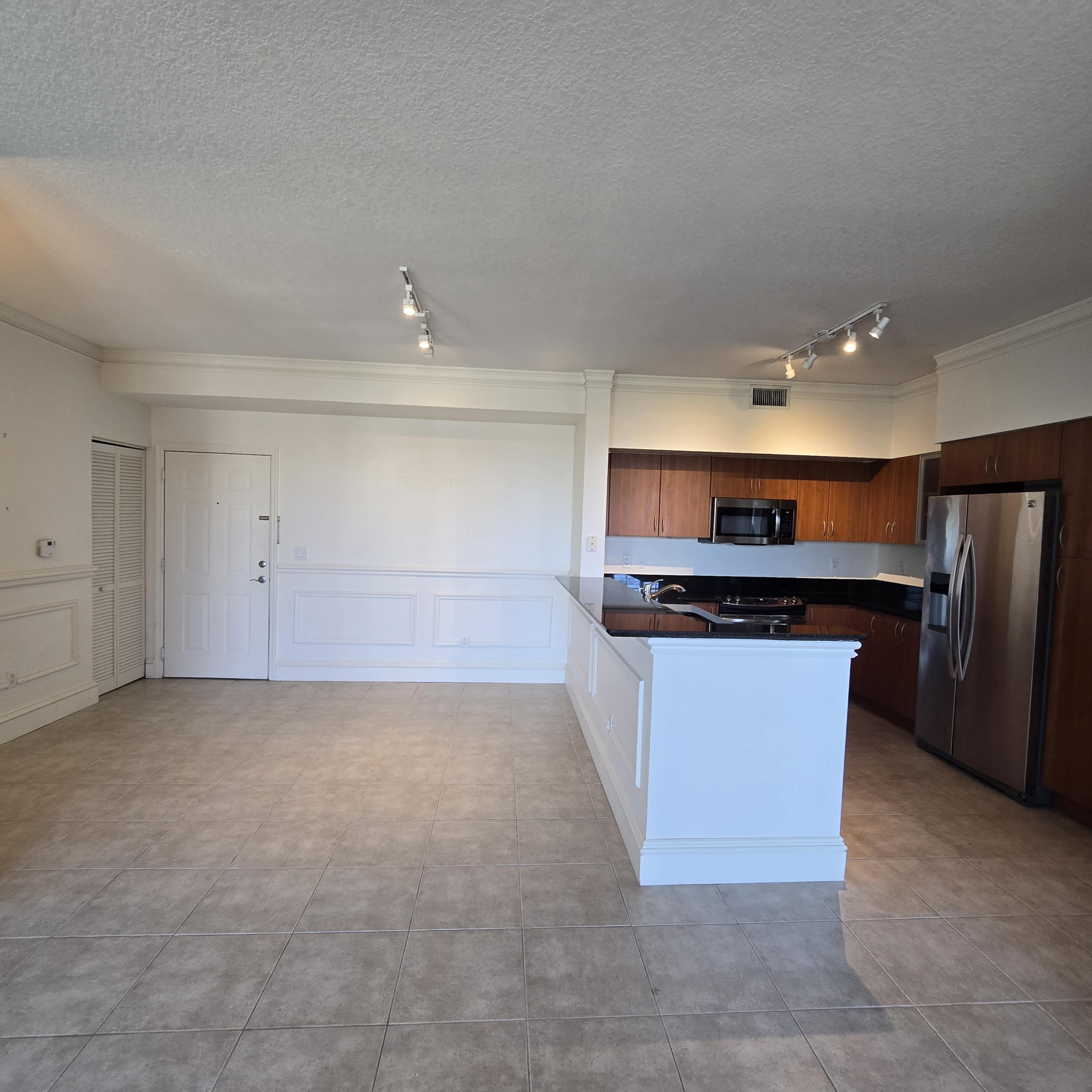 233 South Federal Highway, Unit 721 Boca Raton, FL 33432 - Photo 3 of 50 a kitchen with stainless steel appliances a refrigerator and a stove