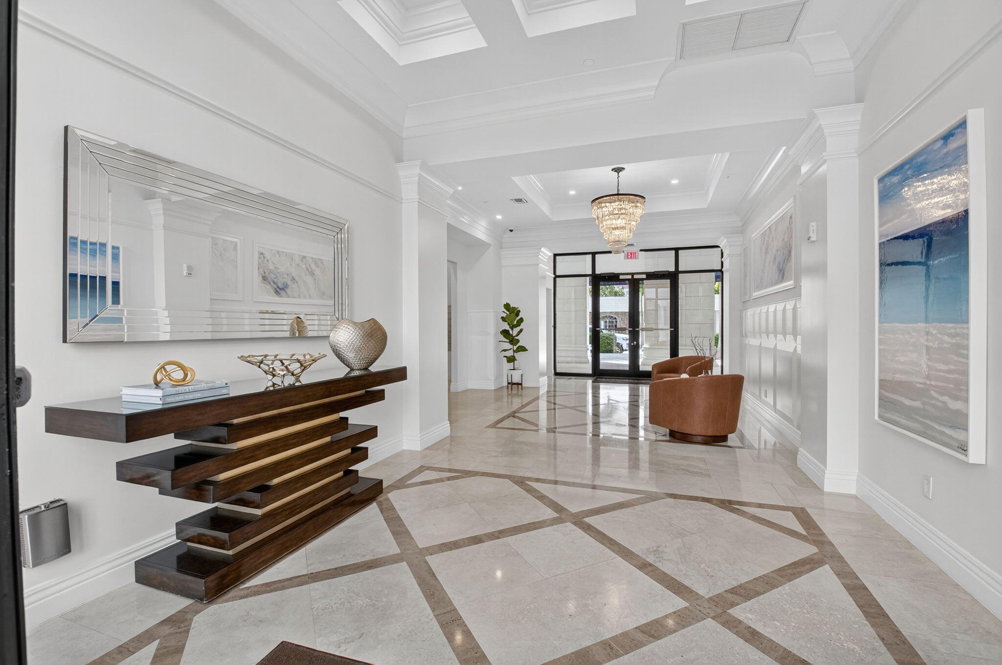 233 South Federal Highway, Unit 721 Boca Raton, FL 33432 - Photo 40 of 50 a living room with furniture a chandelier and a piano
