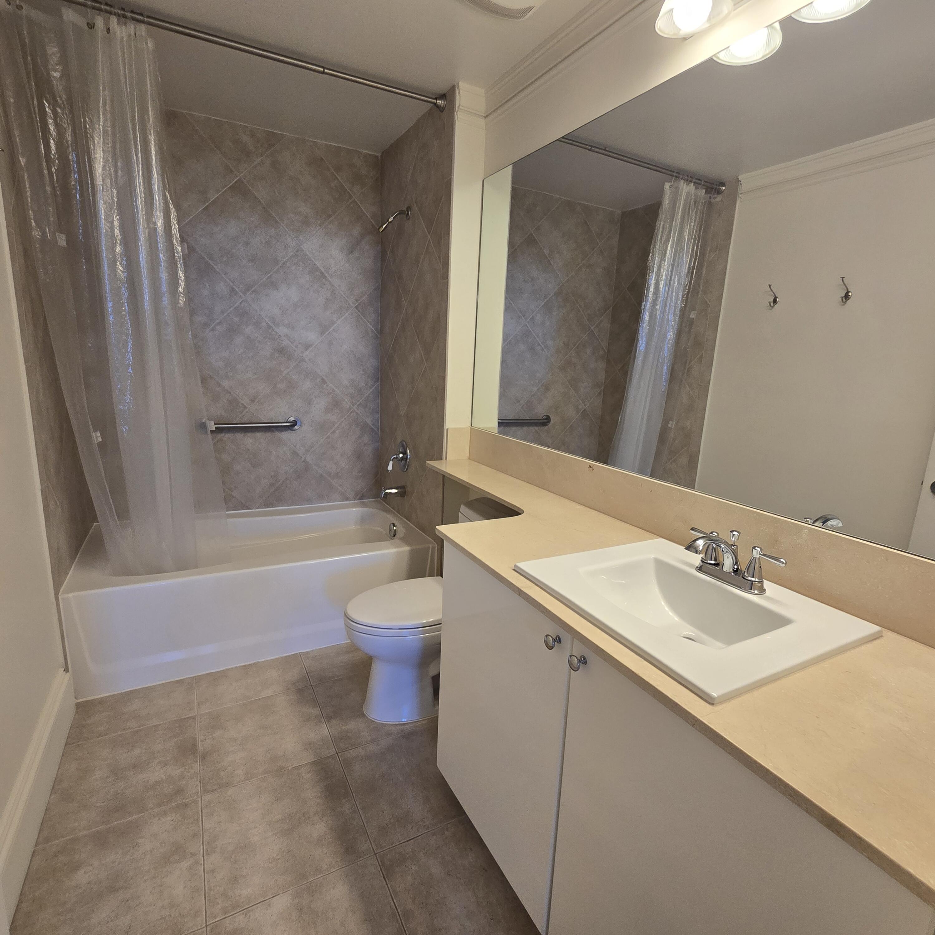 233 South Federal Highway, Unit 721 Boca Raton, FL 33432 - Photo 8 of 50 a bathroom with a granite countertop sink a toilet and shower