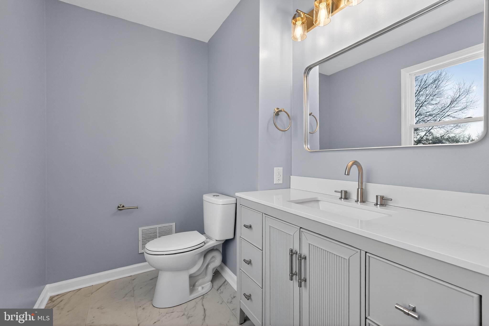 1173 Independence Way Hatfield, PA 19440 - Photo 22 of 26 a bathroom with a toilet sink and mirror
