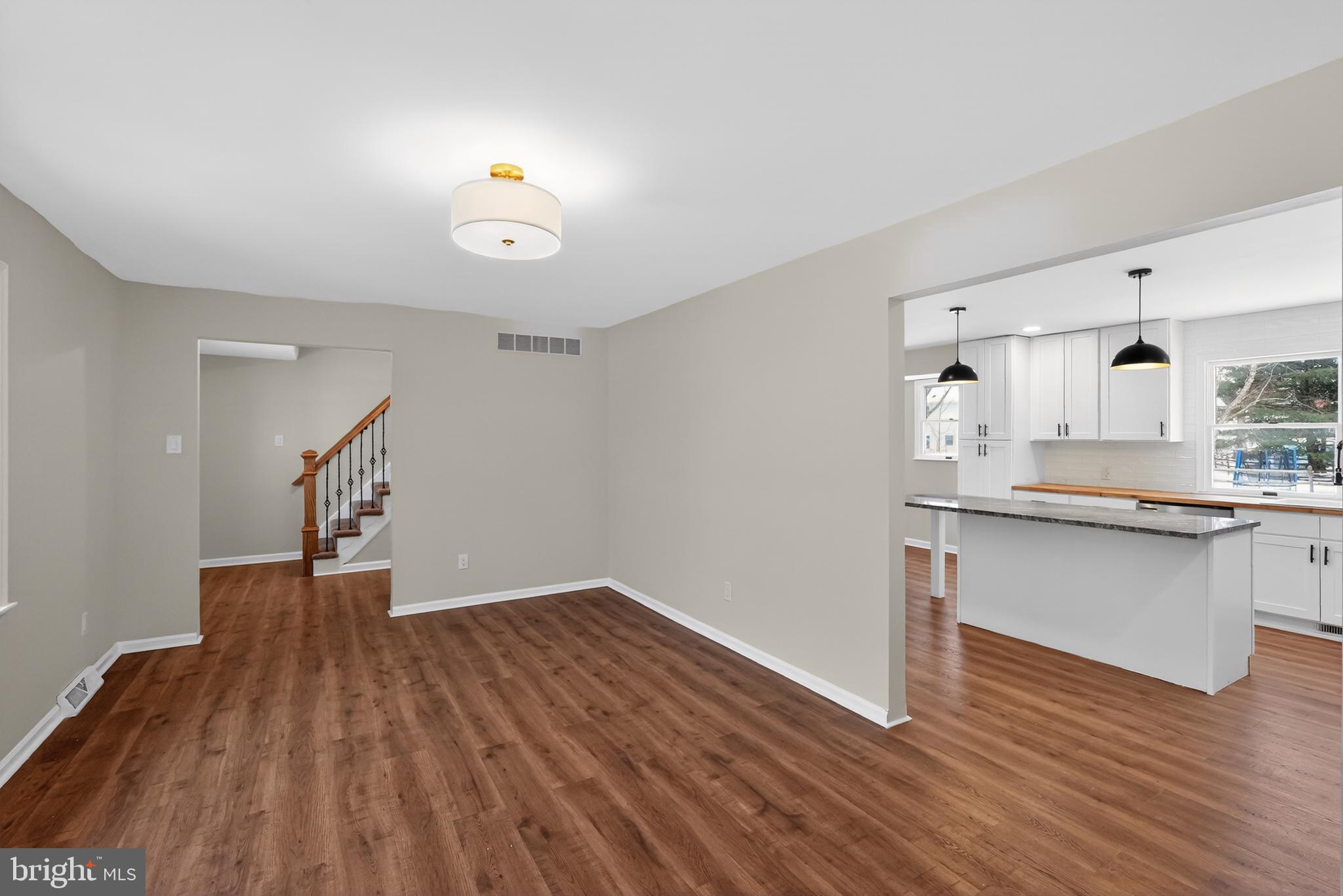 1173 Independence Way Hatfield, PA 19440 - Photo 5 of 26 a kitchen with granite countertop a refrigerator and a wooden floor