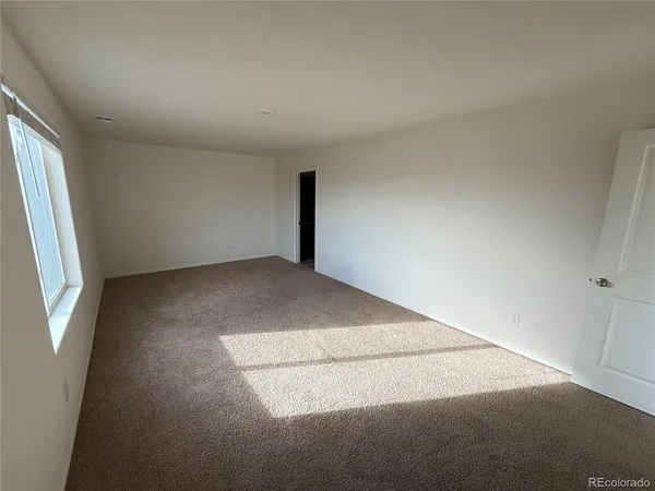 a spacious bathroom with a granite countertop sink and a mirror