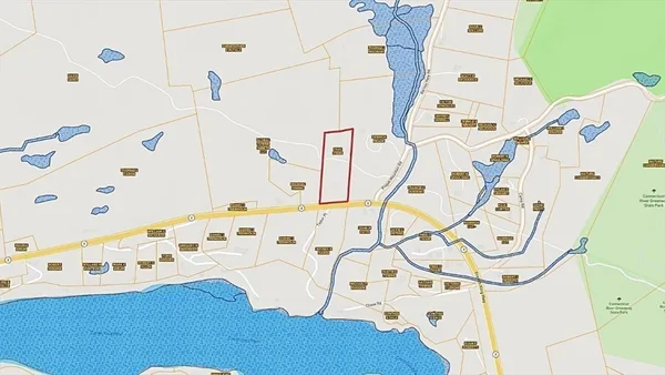 a white bath tub sitting next to a white wall