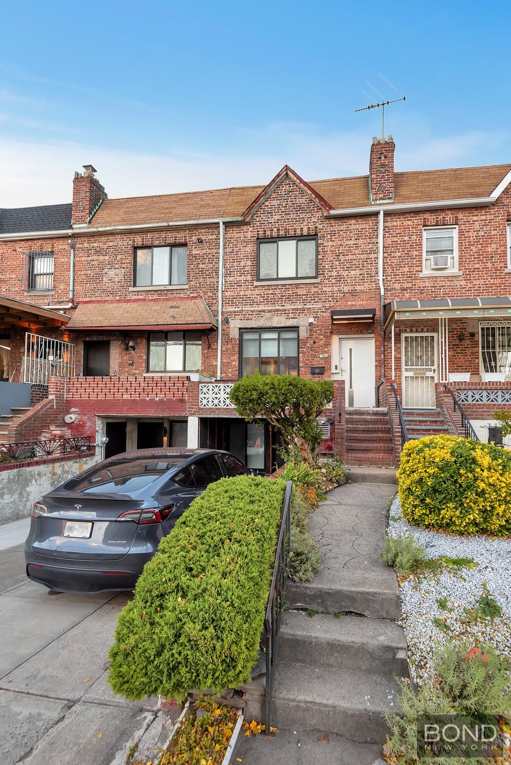 103 Remsen Avenue Brooklyn, NY 11212 - Photo 11 of 11 a front view of a residential apartment building with a yard