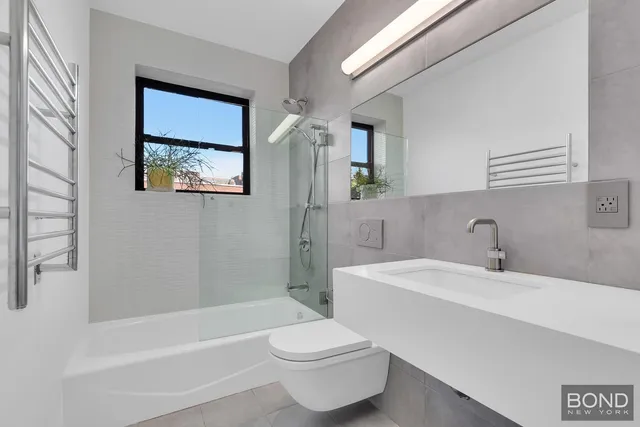 a bathroom with a sink toilet and bathtub