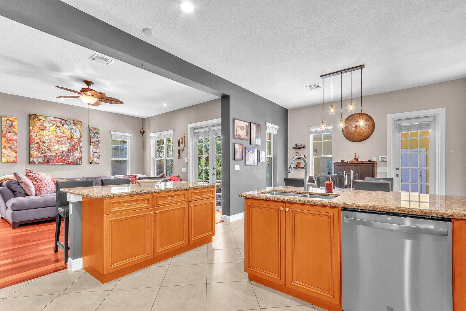 122 Inkberry Drive Jupiter, FL 33458 - Photo 12 of 56 a kitchen with a sink a counter top space and living room view