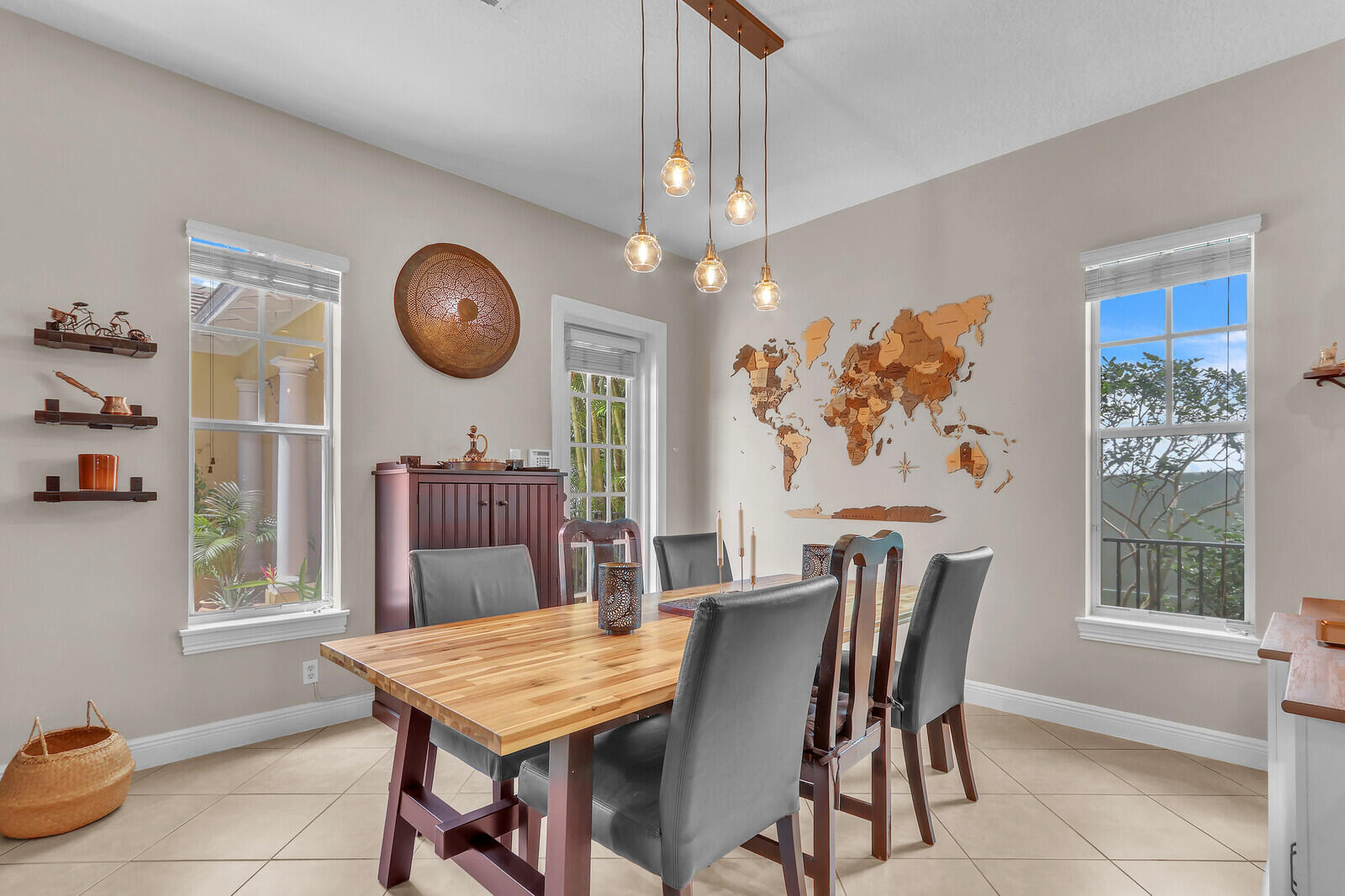 122 Inkberry Drive Jupiter, FL 33458 - Photo 15 of 56 a view of a dining room with furniture and window