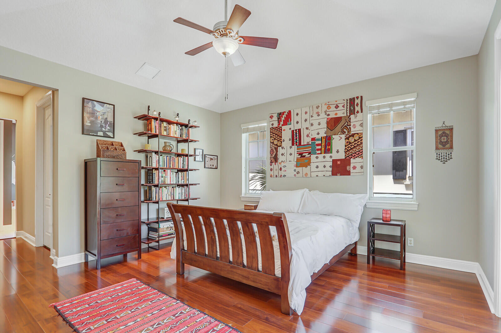 122 Inkberry Drive Jupiter, FL 33458 - Photo 22 of 56 a bedroom with a bed and a bookshelf