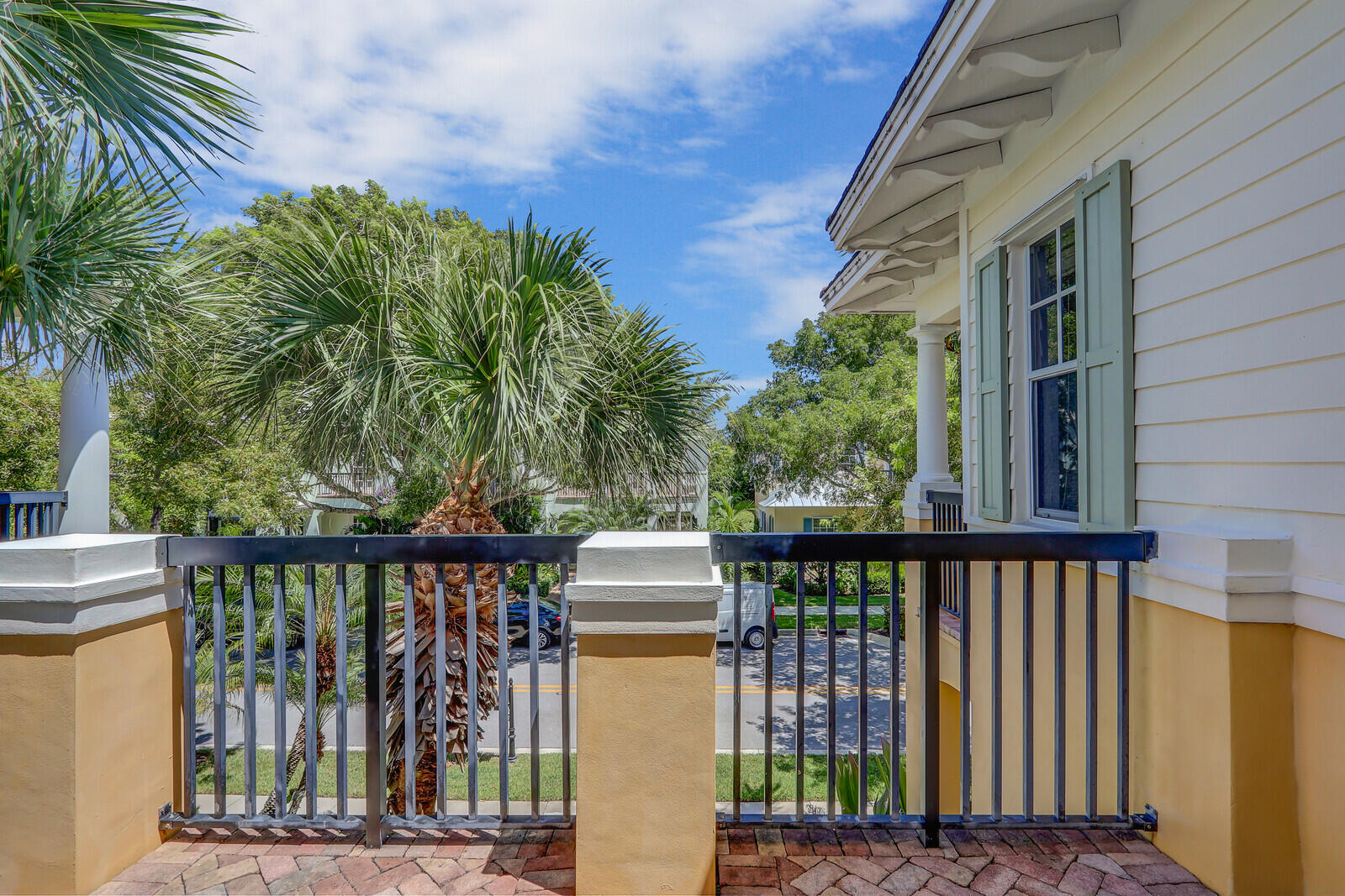 122 Inkberry Drive Jupiter, FL 33458 - Photo 25 of 56 a balcony with table and chairs and wooden fence