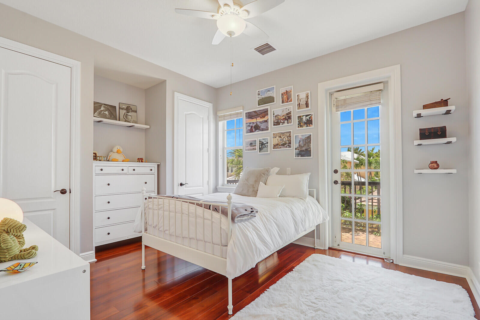 122 Inkberry Drive Jupiter, FL 33458 - Photo 30 of 56 a bedroom with a bed and a window