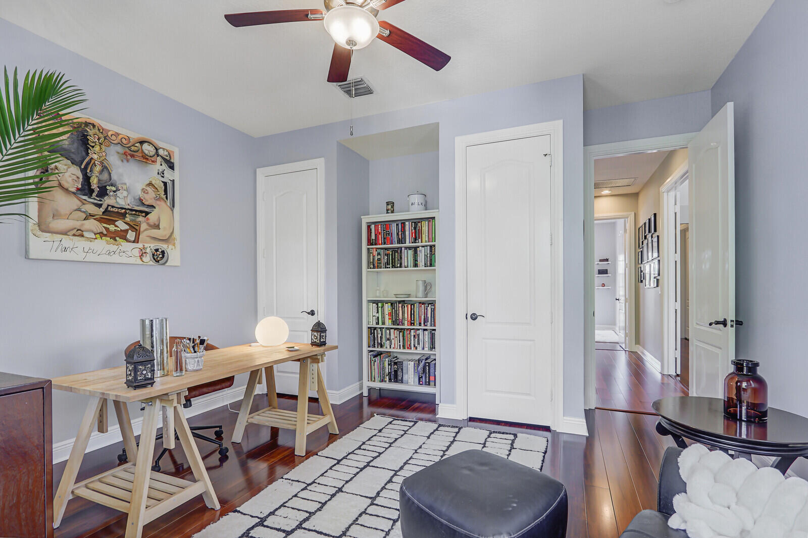 122 Inkberry Drive Jupiter, FL 33458 - Photo 34 of 56 a living room with furniture and a bookshelf