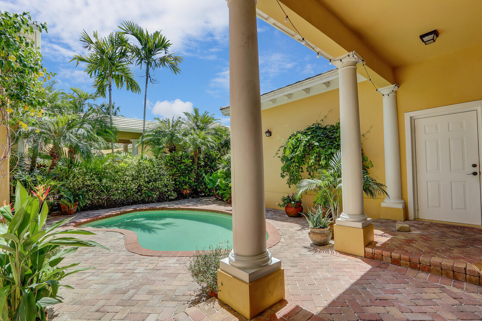 122 Inkberry Drive Jupiter, FL 33458 - Photo 40 of 56 a house view with a garden space