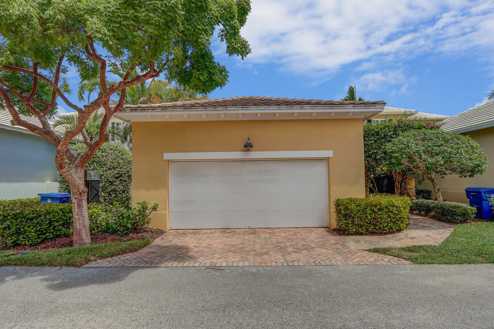 122 Inkberry Drive Jupiter, FL 33458 - Photo 41 of 56 a front view of a house with a yard and garage