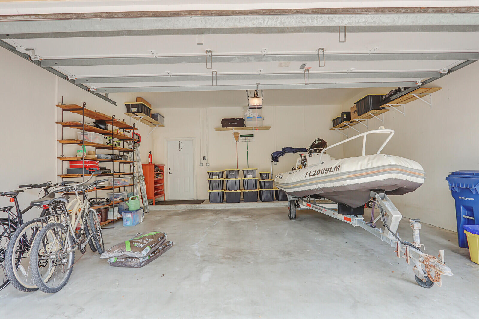 122 Inkberry Drive Jupiter, FL 33458 - Photo 42 of 56 a view of a room with gym equipment