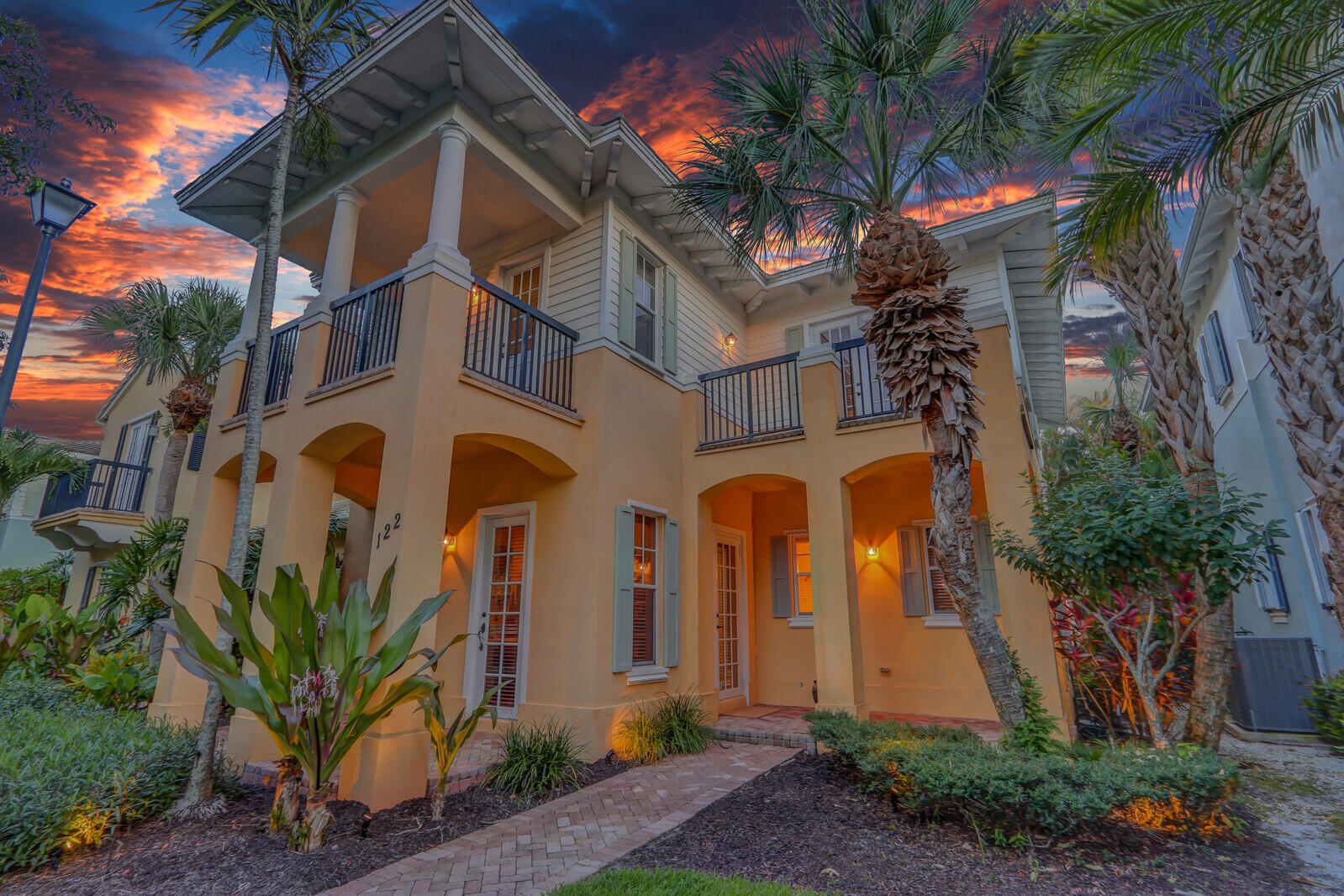 122 Inkberry Drive Jupiter, FL 33458 - Photo 44 of 56 a front view of a house with a yard