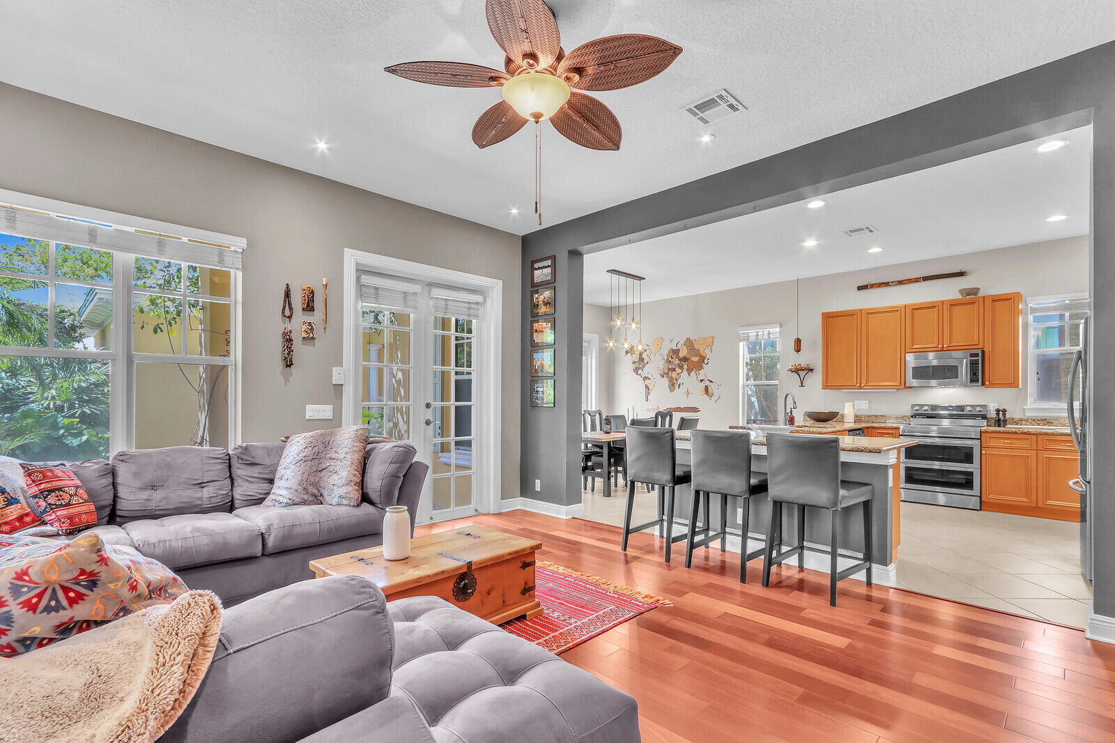 122 Inkberry Drive Jupiter, FL 33458 - Photo 6 of 56 a living room with furniture kitchen view and a large window