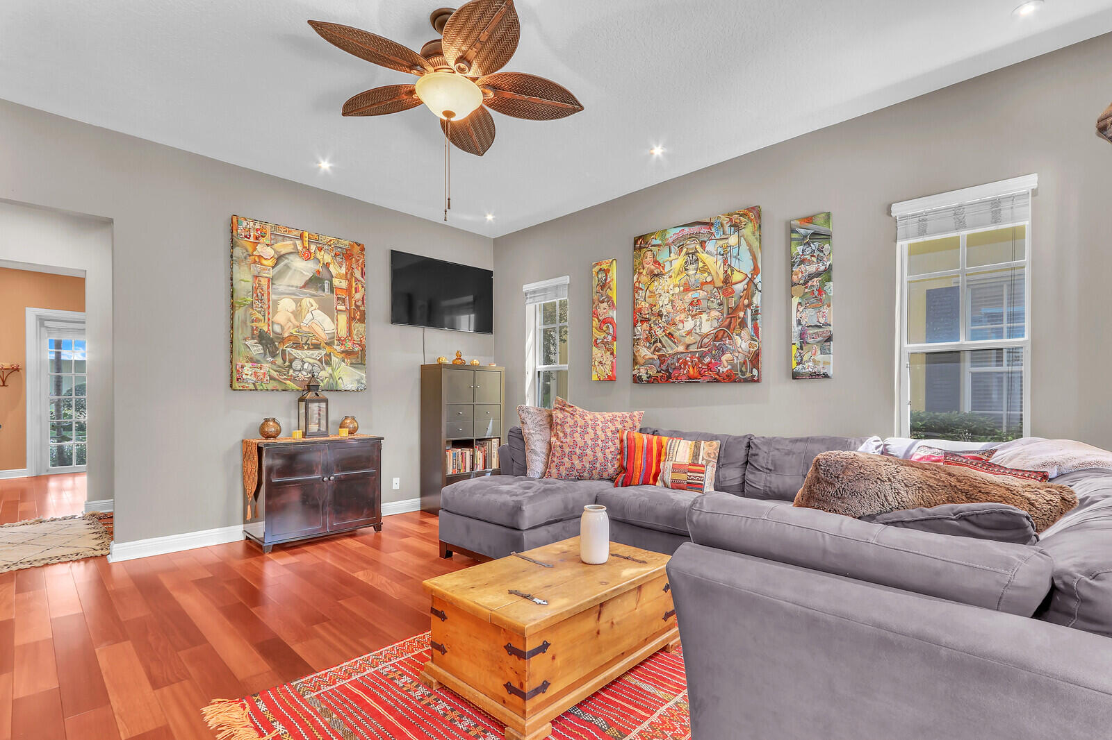 122 Inkberry Drive Jupiter, FL 33458 - Photo 8 of 56 a living room with furniture a fireplace and a flat screen tv