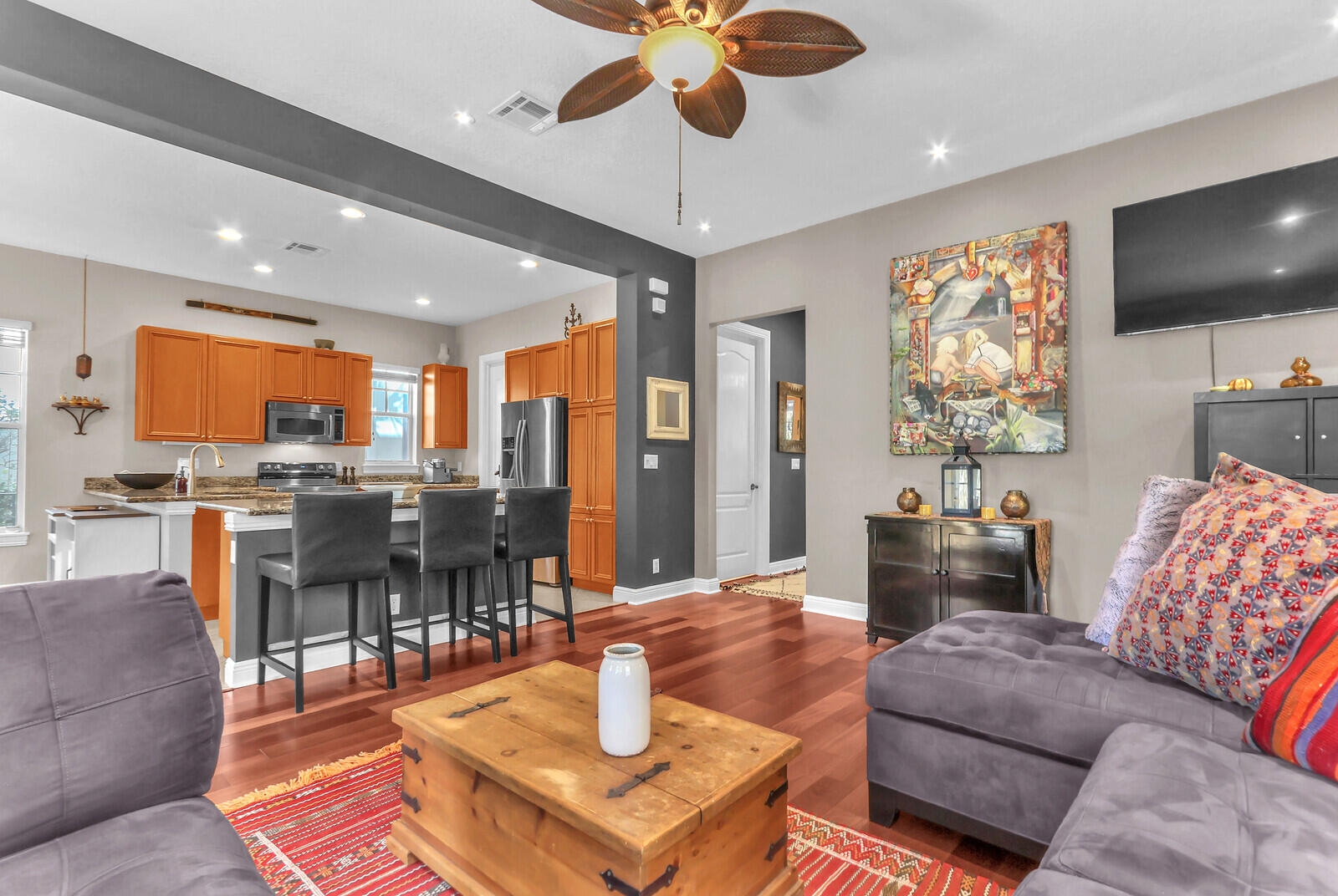 122 Inkberry Drive Jupiter, FL 33458 - Photo 9 of 56 a living room with furniture and a flat screen tv