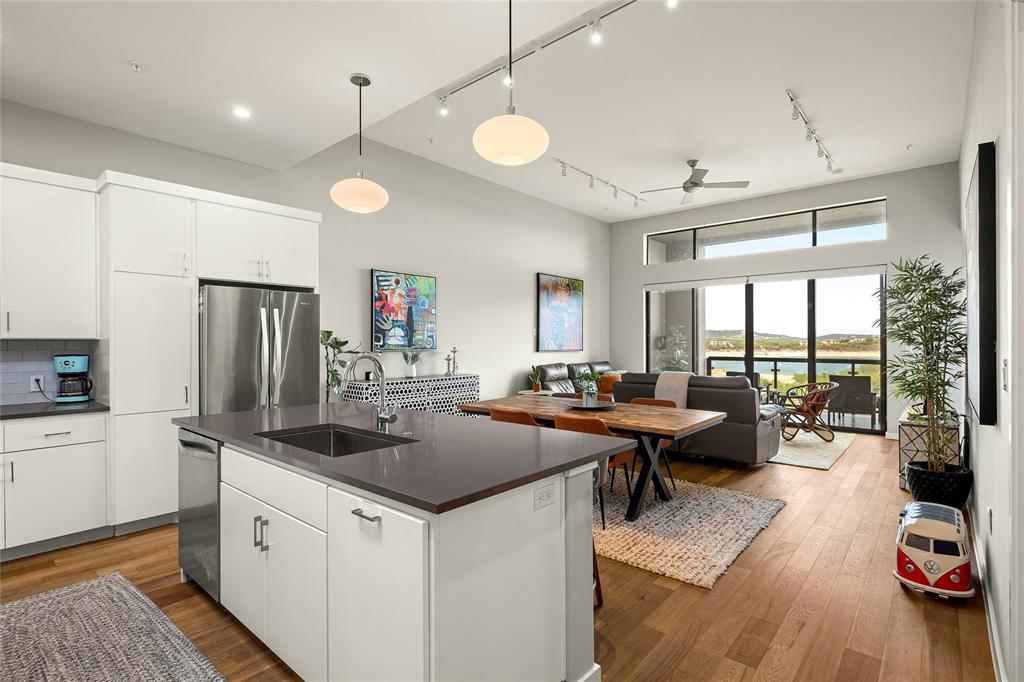 a kitchen with counter space appliances a sink and a window