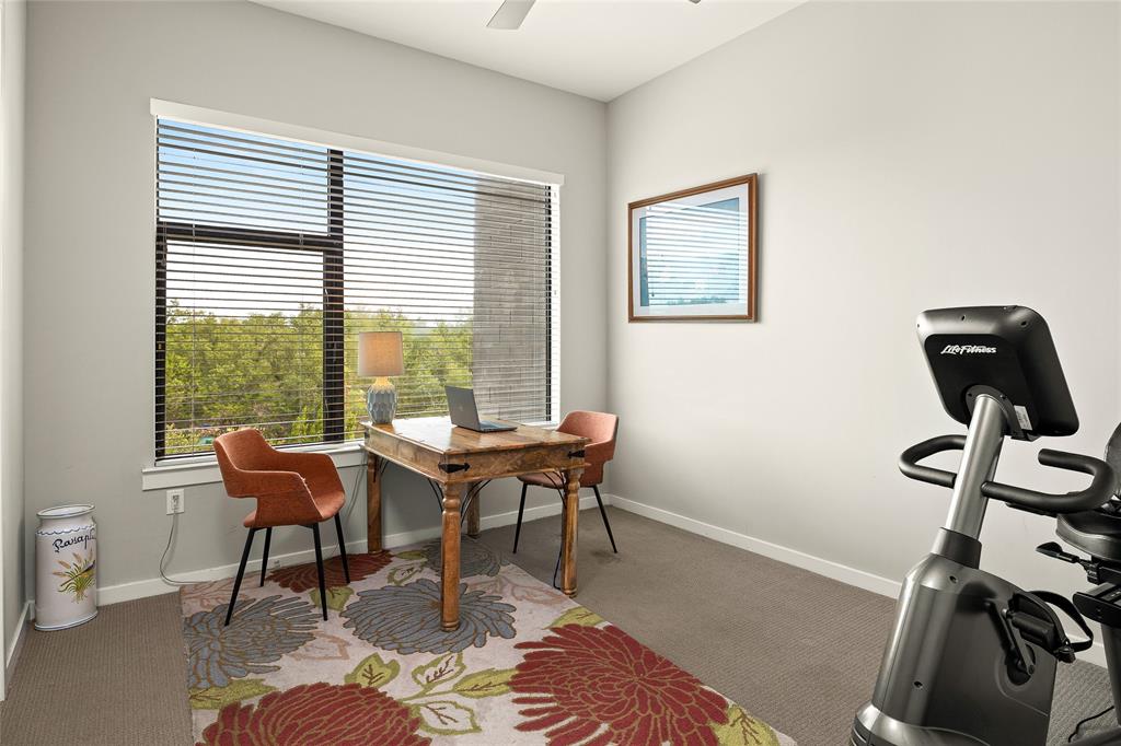 5921 Hiline Road, Unit 2404 Austin, TX 78734 - Photo 26 of 36 a view of a workspace with furniture and a window