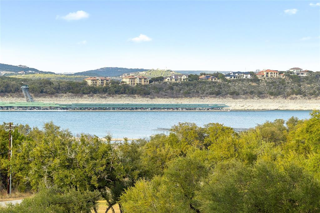 5921 Hiline Road, Unit 2404 Austin, TX 78734 - Photo 30 of 36 a view of a lake with mountains in the background