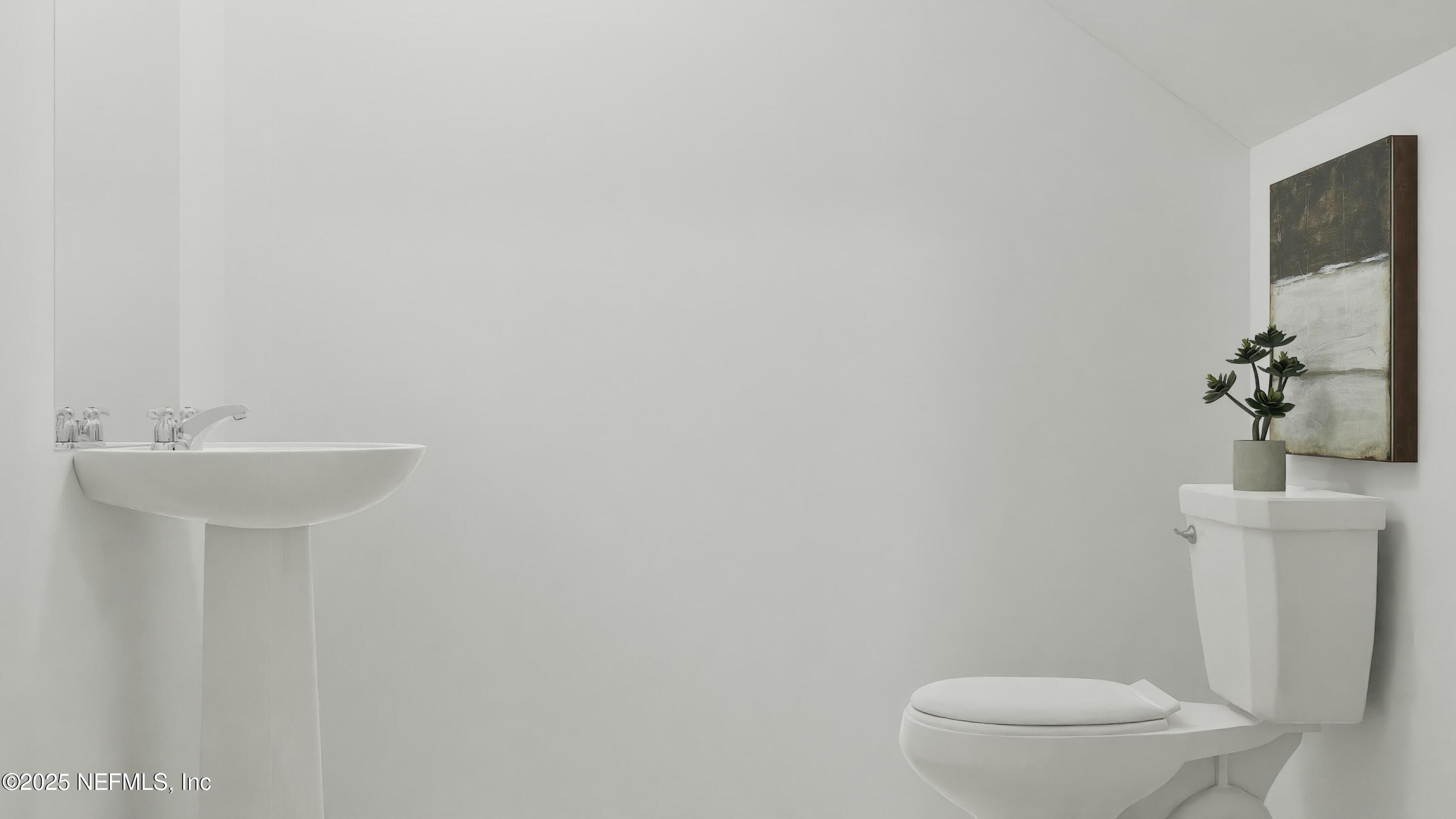 3963 Mid Century Street Jacksonville, FL 32217 - Photo 22 of 22 a bathroom with a sink a toilet and mirror