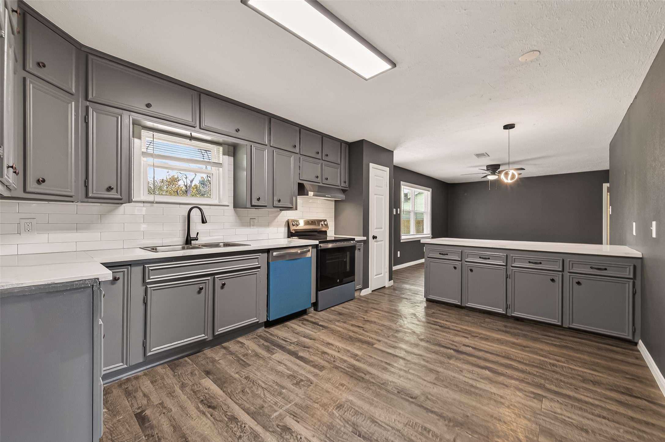 2619 Sinclair Street Pasadena, TX 77503 - Photo 11 of 29 a kitchen with sink cabinets and window