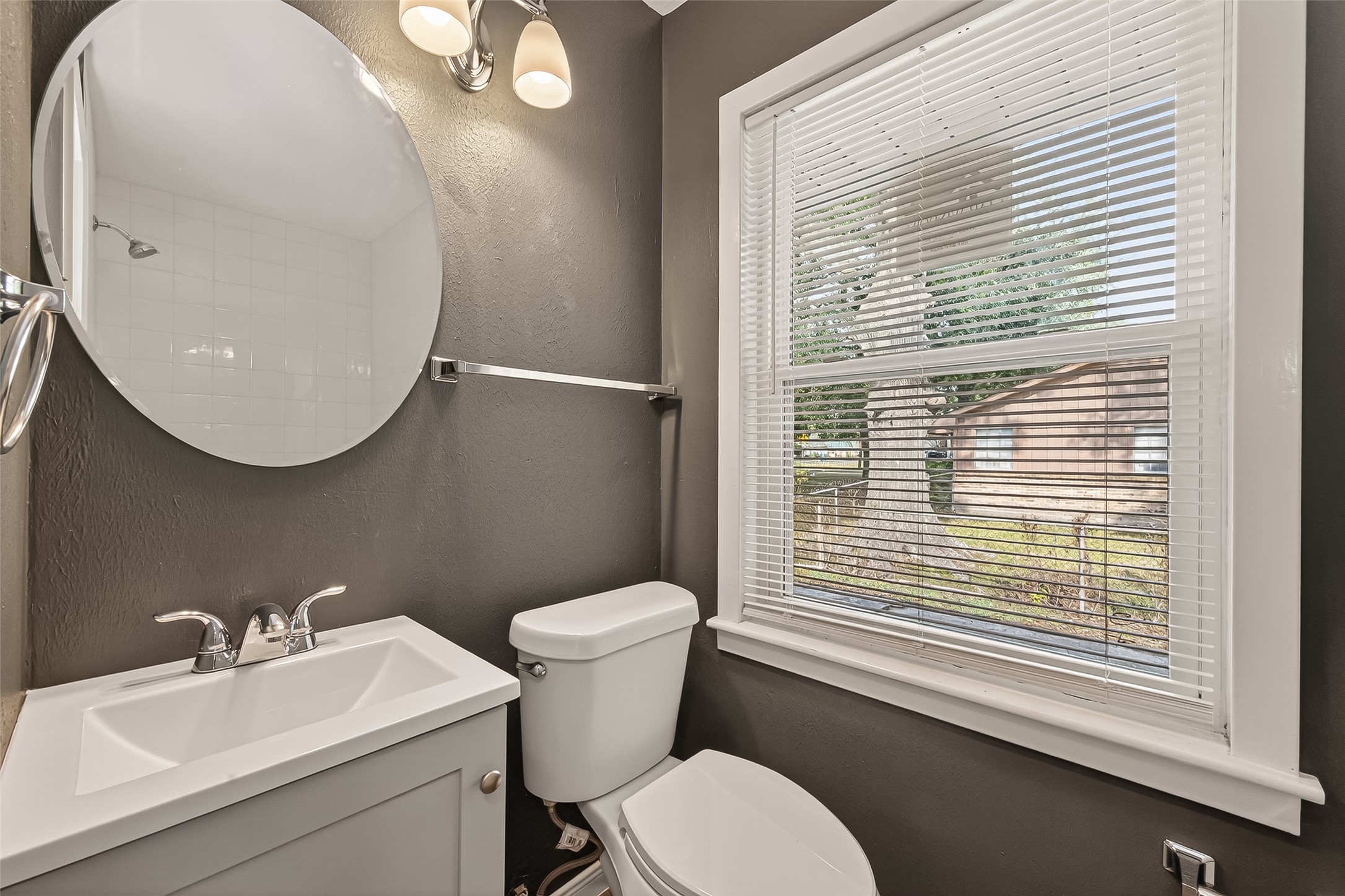 2619 Sinclair Street Pasadena, TX 77503 - Photo 14 of 29 a bathroom with a toilet a sink and mirror