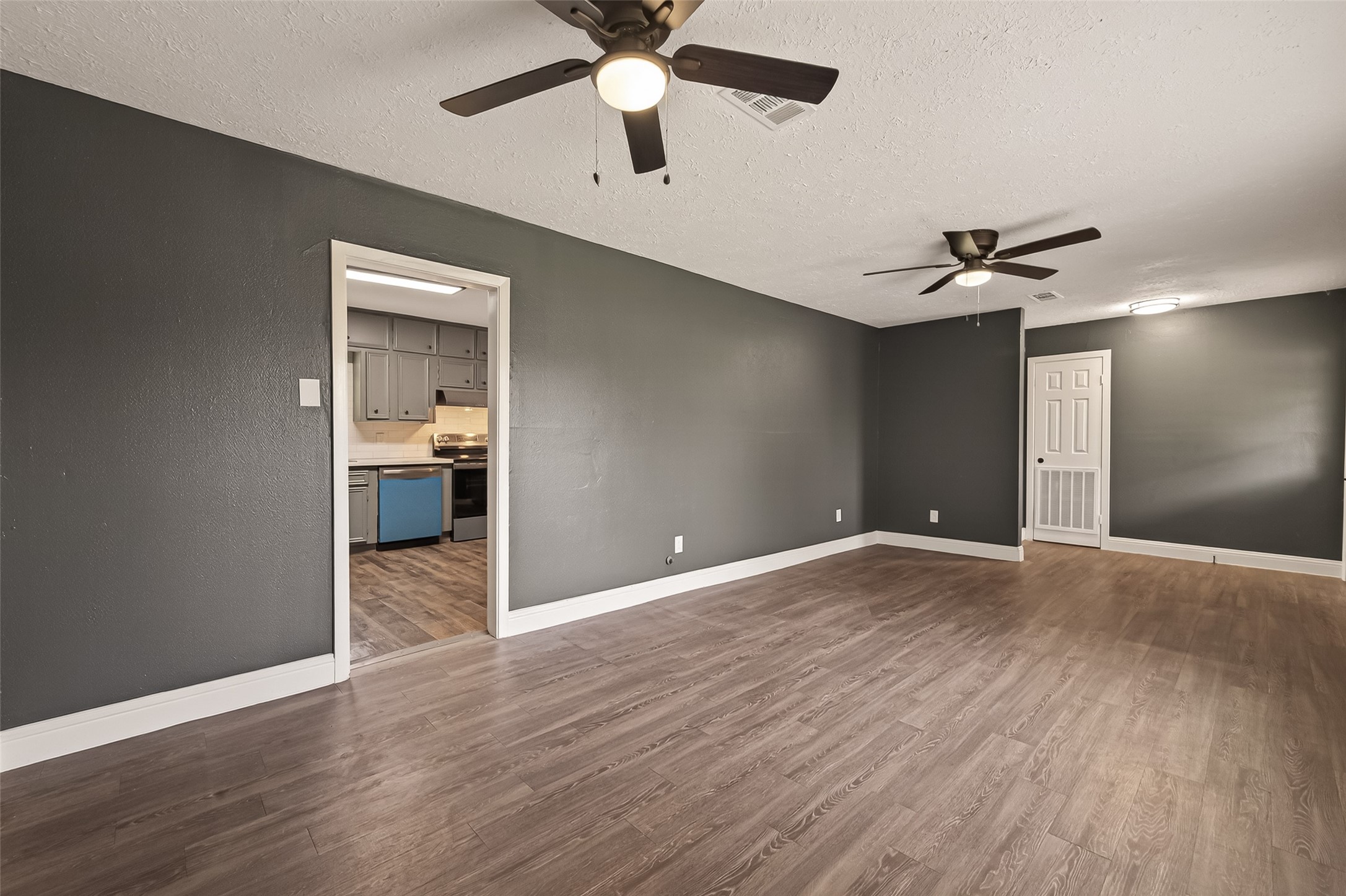 2619 Sinclair Street Pasadena, TX 77503 - Photo 5 of 29 a view of a room with wooden floor and a ceiling fan