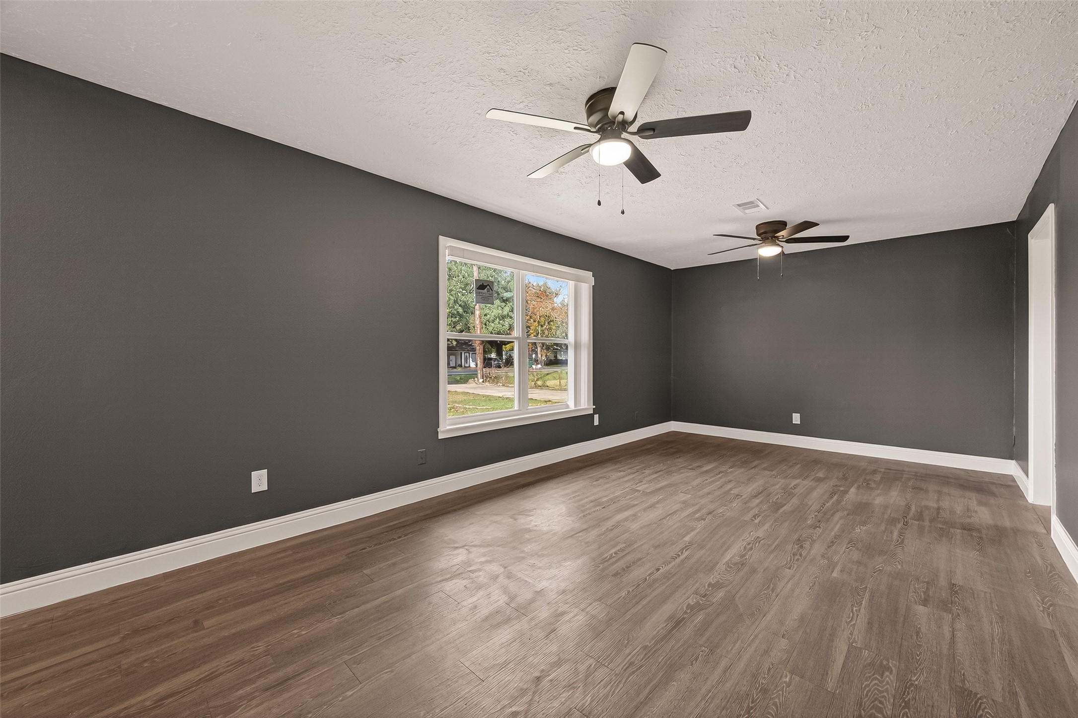 2619 Sinclair Street Pasadena, TX 77503 - Photo 7 of 29 a view of a big room with wooden floor and windows