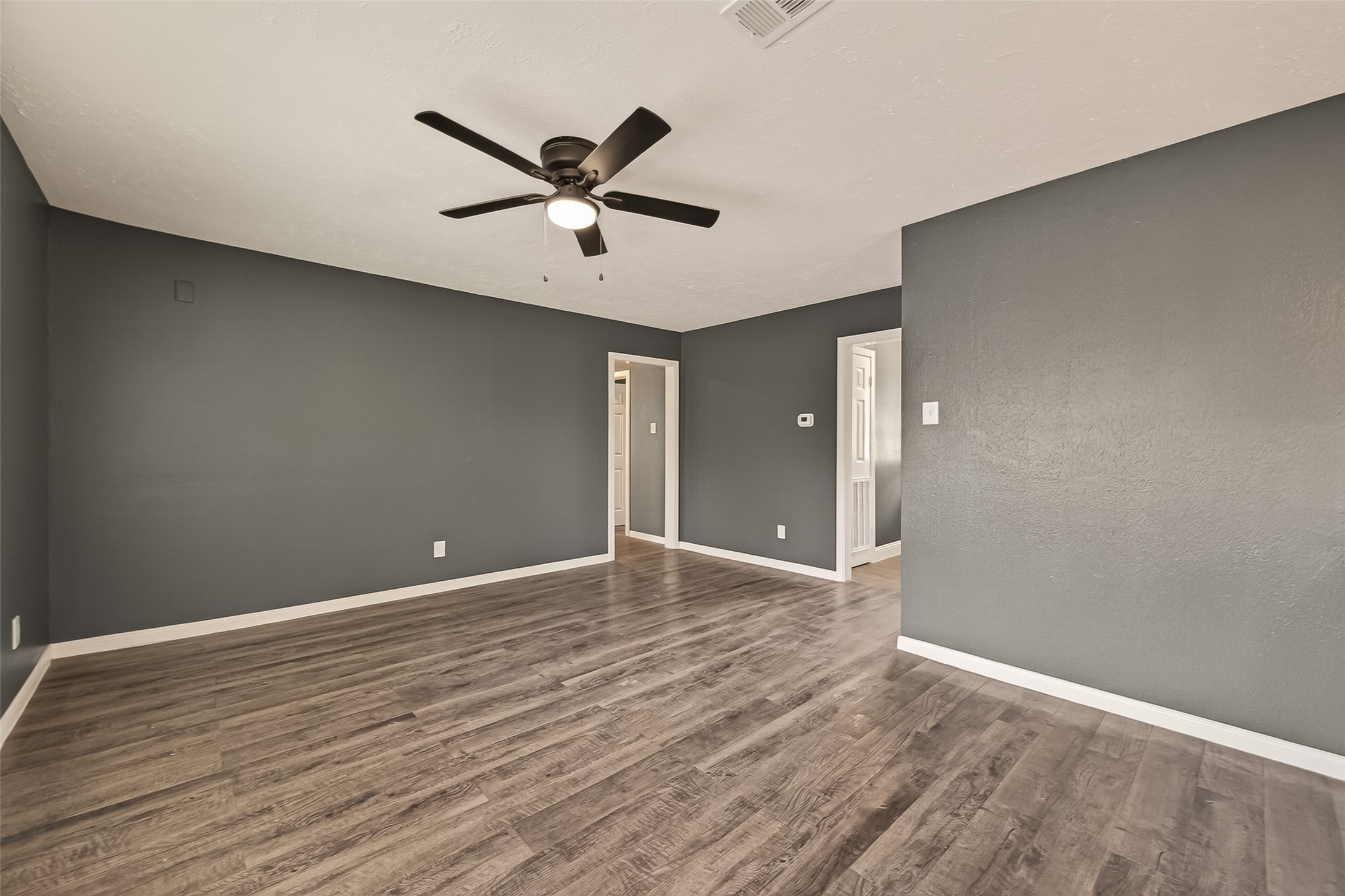2619 Sinclair Street Pasadena, TX 77503 - Photo 8 of 29 a view of a big room with wooden floor and windows