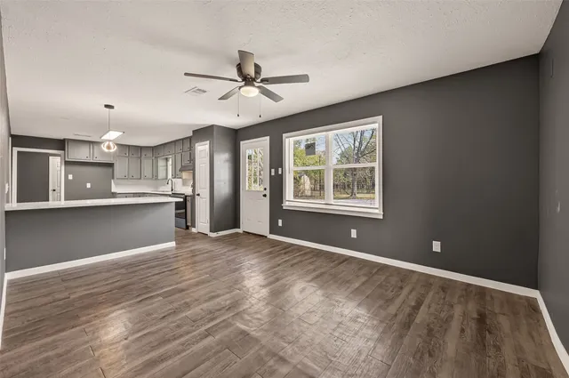 a kitchen with sink cabinets and window