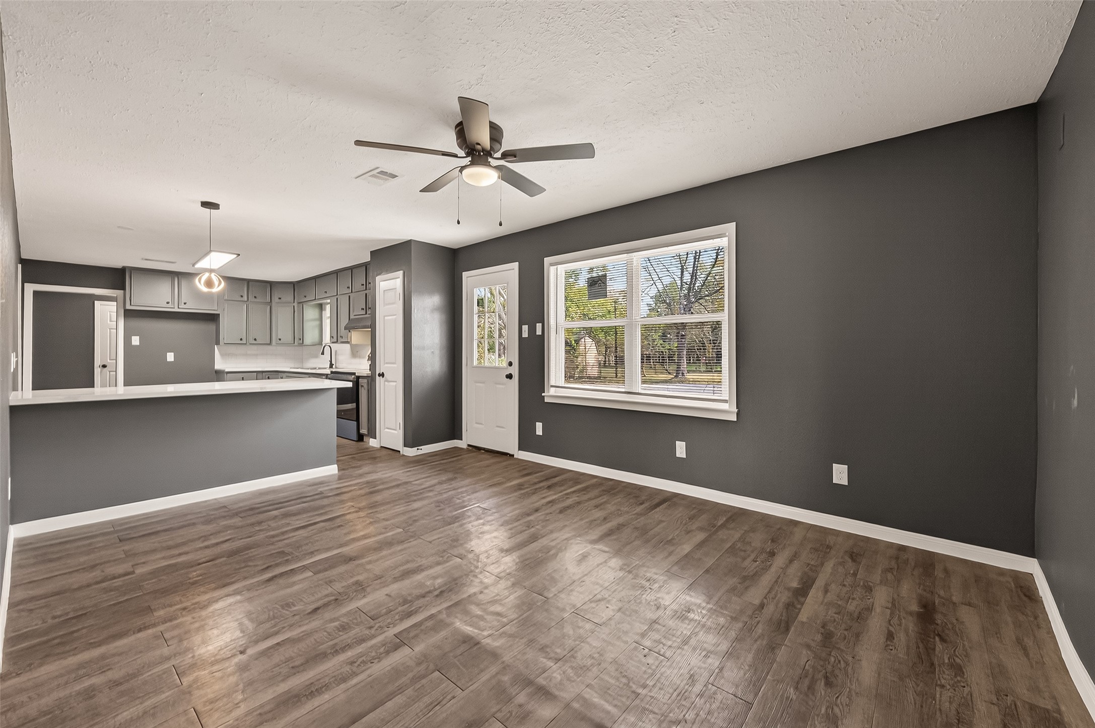 2619 Sinclair Street Pasadena, TX 77503 - Photo 10 of 29 a view of an empty room with window and wooden floor