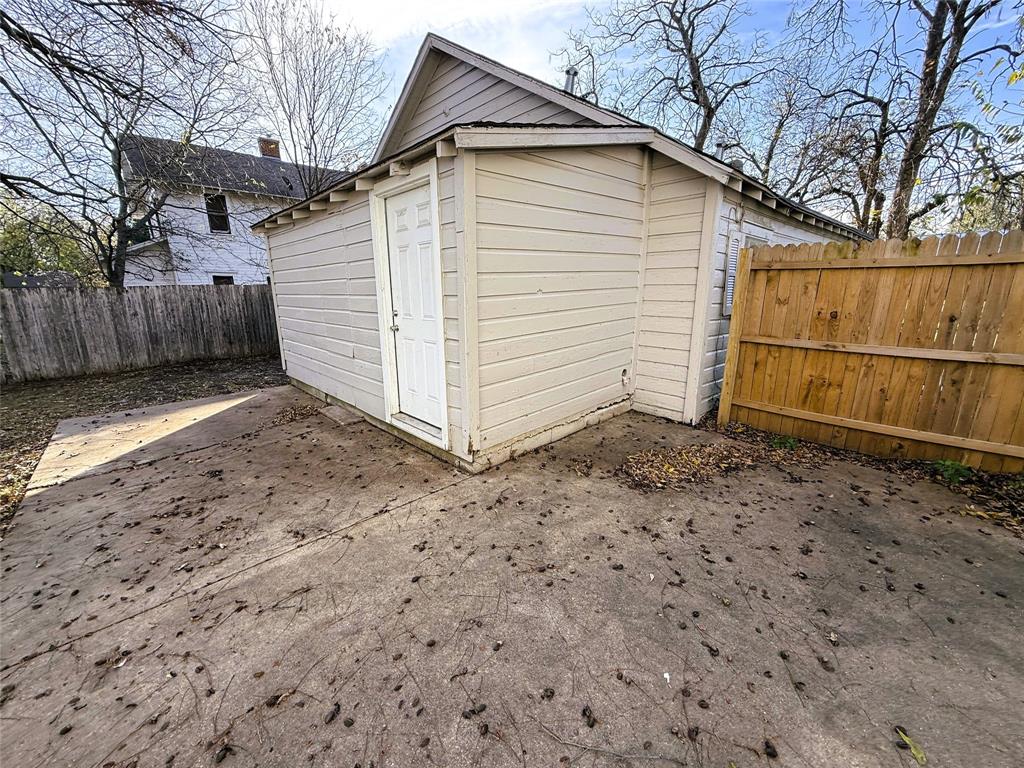 402 West 4th Street, Unit 1 Kaufman, TX 75142 - Photo 17 of 18 a view of a small house with a yard