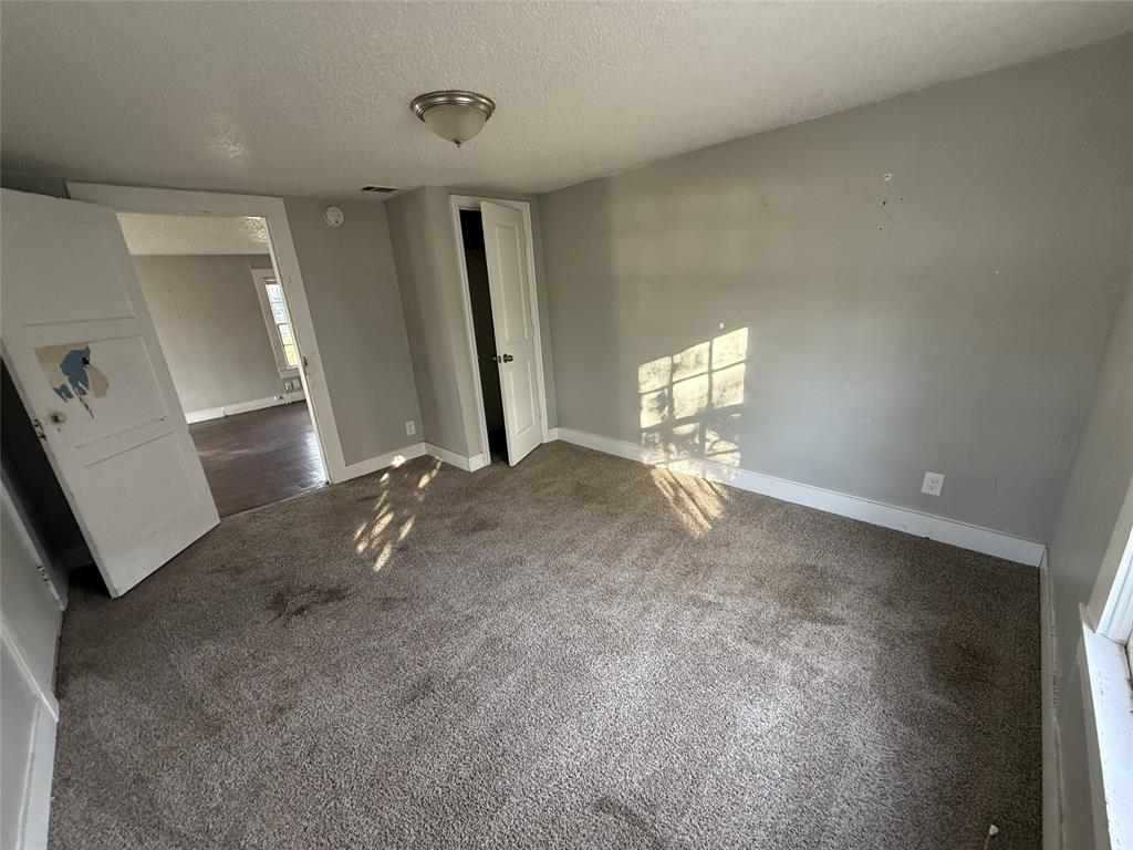402 West 4th Street, Unit 1 Kaufman, TX 75142 - Photo 8 of 18 a view of a livingroom with a staircase